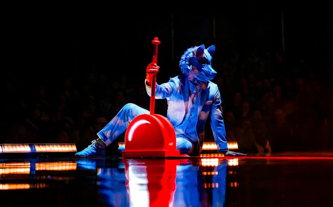 Performer in blue costume with animal mask at Cirque Du Soleil ECHO show.