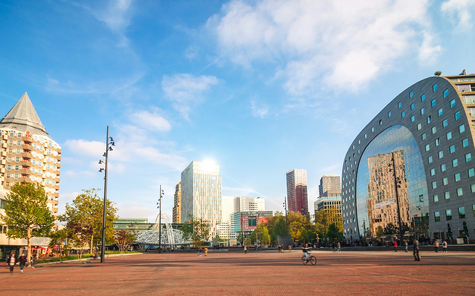 Markthal in Rotterdam with surrounding modern architecture and open plaza.