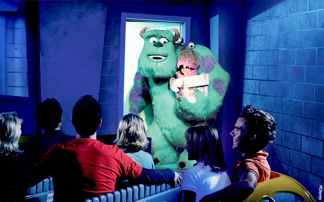 Guests on the Monster's Inc. ride at Disneyland Adventure Park California see Sulley holding Boo.
