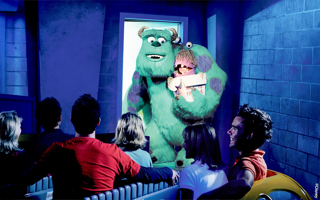 Guests on the Monster's Inc. ride at Disneyland Adventure Park California see Sulley holding Boo.