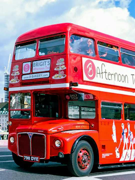 Red double-decker bus for afternoon tea tour in London.