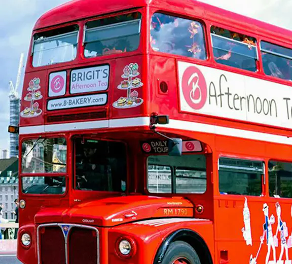 Red double-decker bus for afternoon tea tour in London.