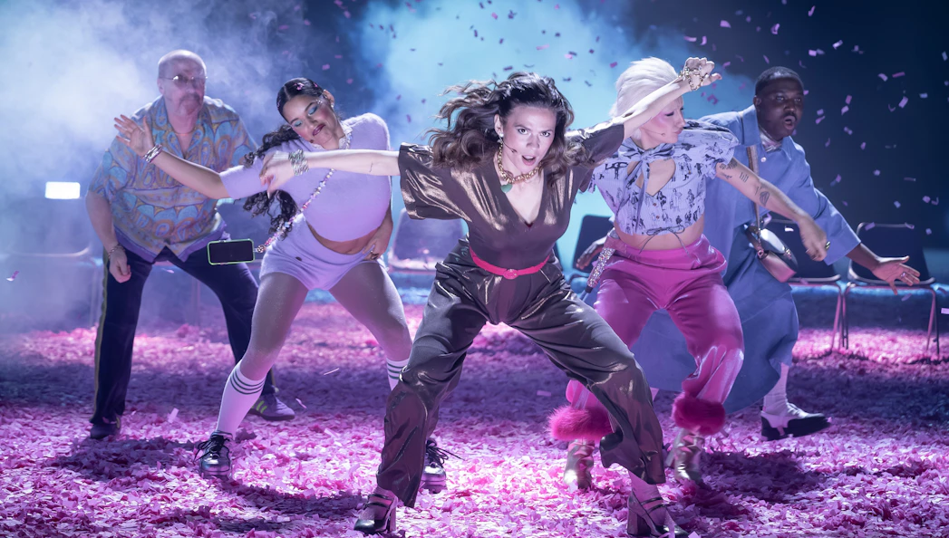 Performers dancing energetically on stage during Much Ado About Nothing show, Broadway.