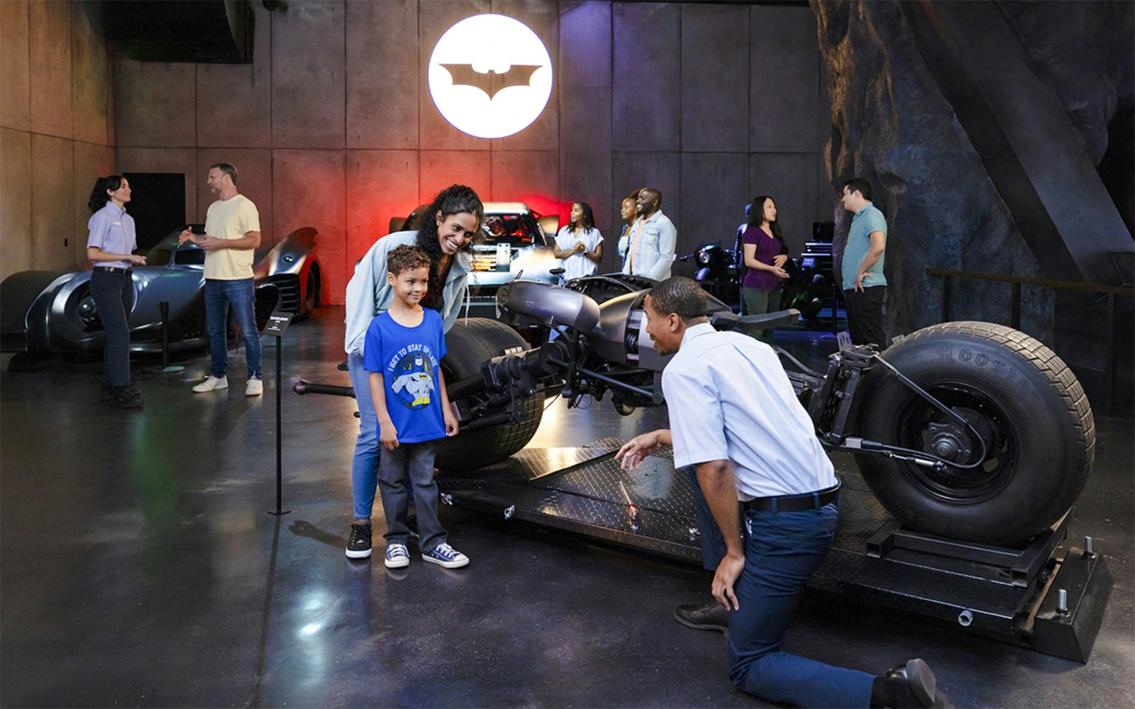 Visitors at Warner Bros Studio in Los Angeles admire the Batmobile exhibit.