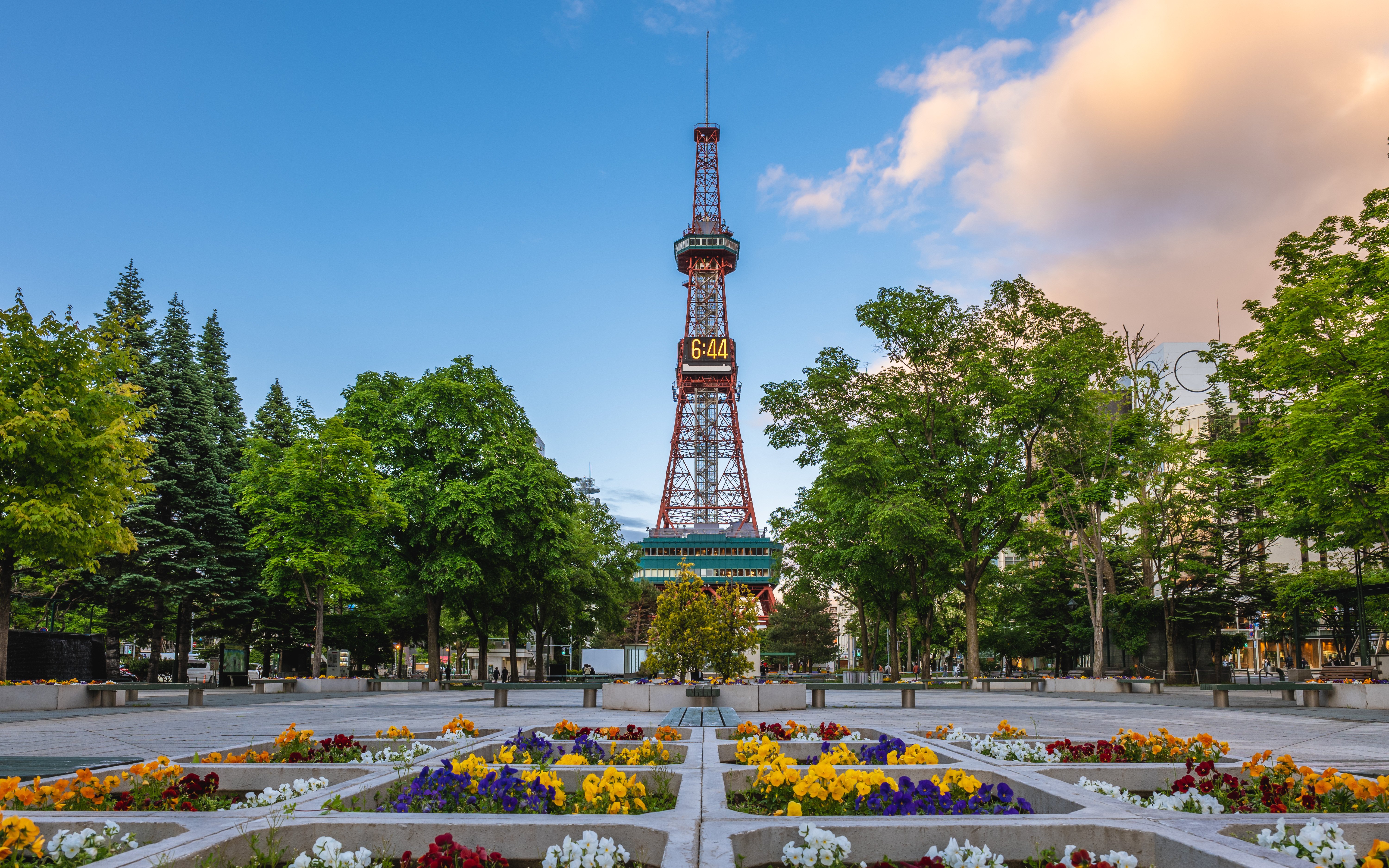 Sapporo TV Tower with colorful flower beds at Odori Park, Sapporo, Hokkaido, Japan.