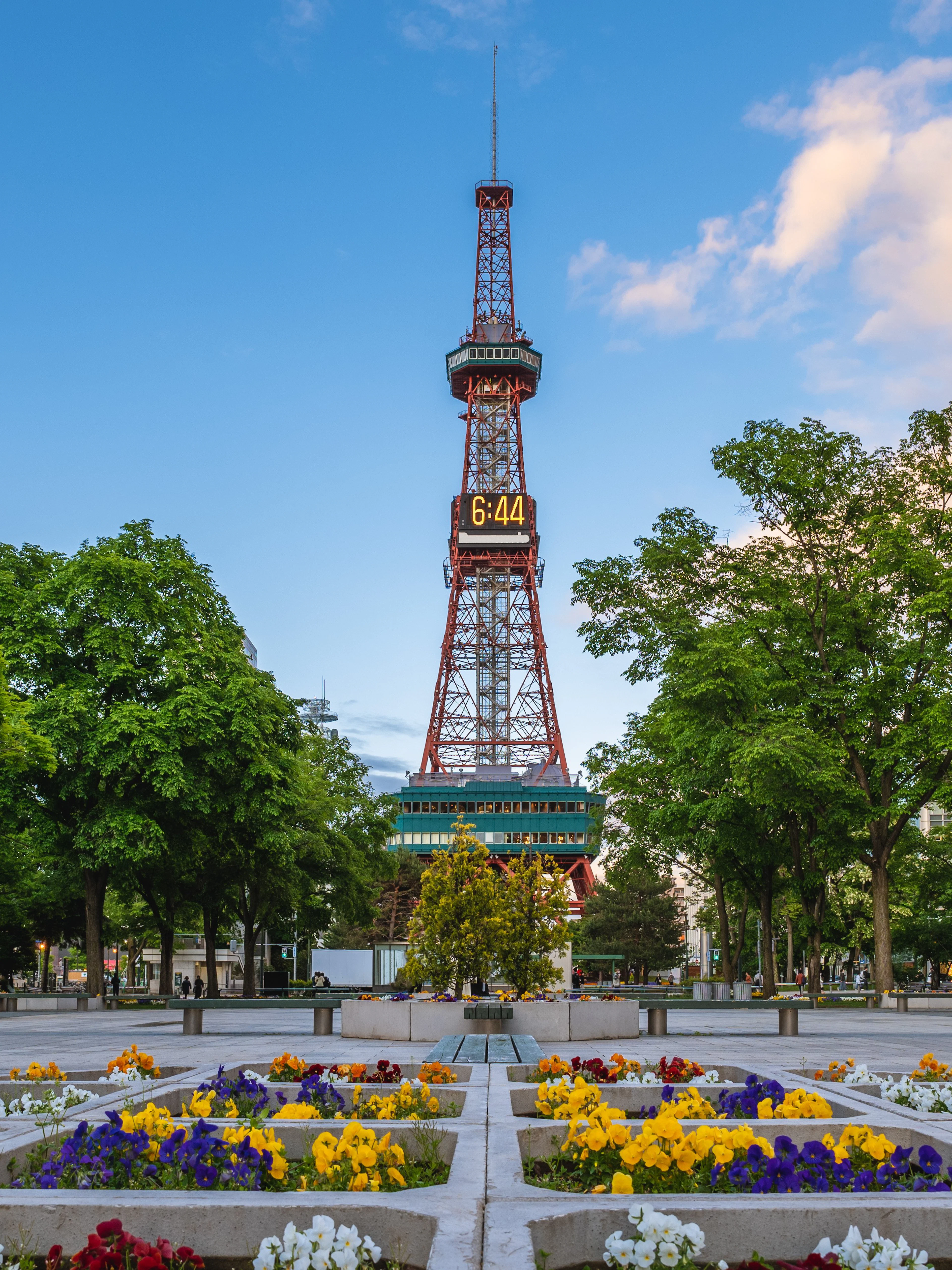 Sapporo TV Tower with colorful flower beds at Odori Park, Sapporo, Hokkaido, Japan.