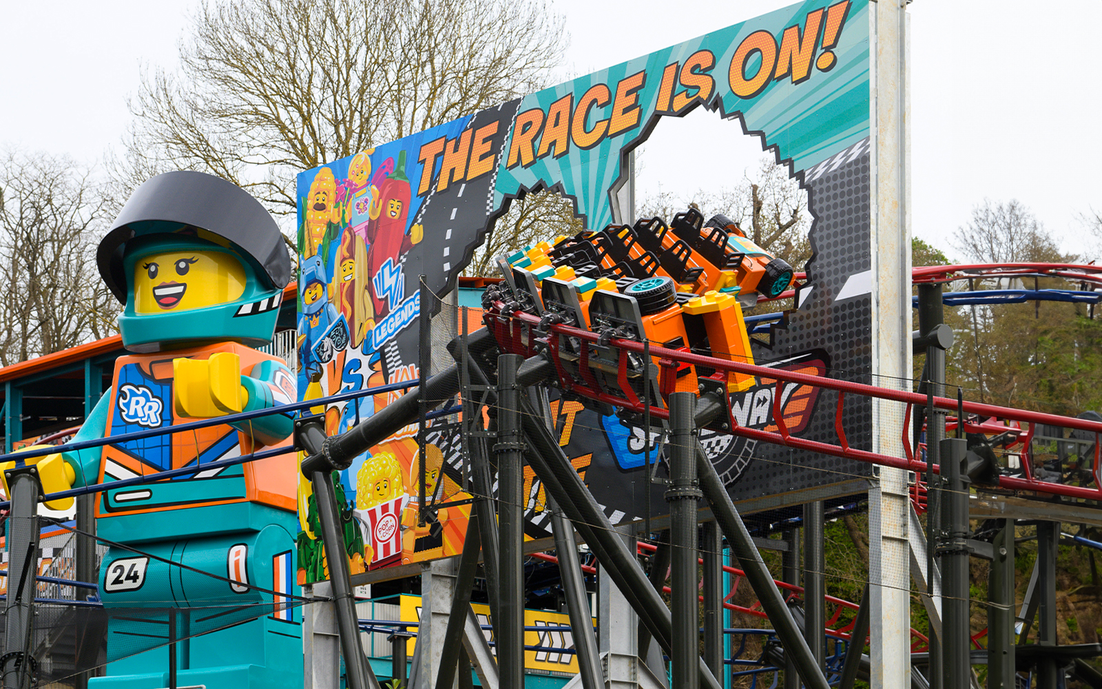 Family enjoying a fun-filled day at LEGOLAND® Windsor Resort, Express tour from London, featuring iconic LEGO® themed rides and attractions