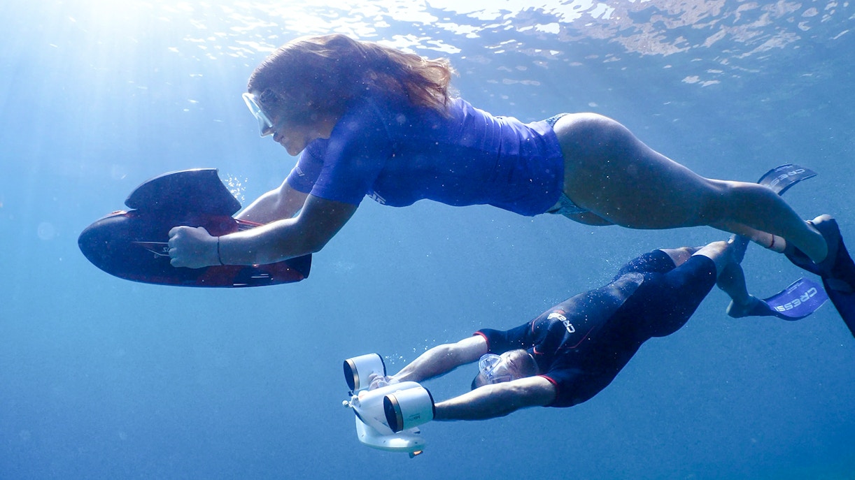 People using underwater scooters in Marseille.