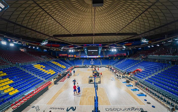 FC Barcelona Palau arena interior with basketball court and seating.