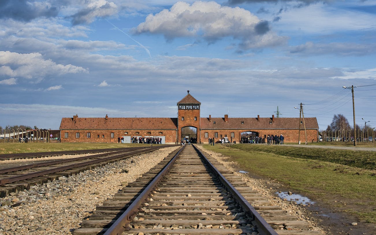 Railway tracks leading to Auschwitz entrance in Poland.
