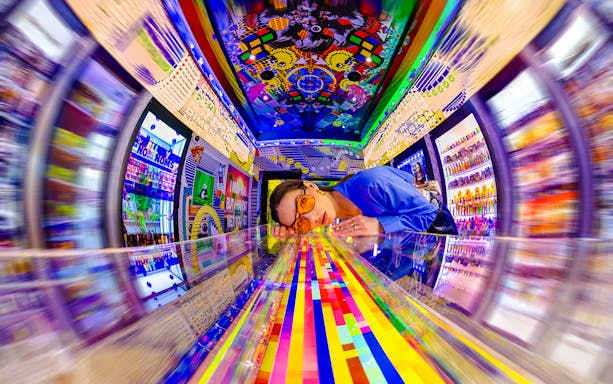 Visitors engaging with digital displays at House of Hype, an interactive attraction in New York City.