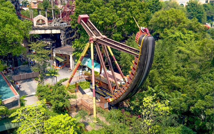 Sunway Lagoon Theme Park pirate ship ride surrounded by lush greenery.