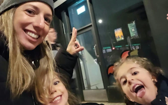 Self-guided ghost hunt participants smiling in Dublin at night.