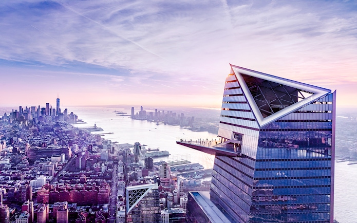 Aerial view of The Edge observation deck with New York City skyline in the background.