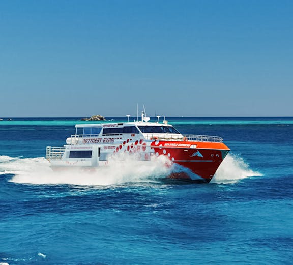 Ferry cruising on blue waters near Rottnest Island, Australia.