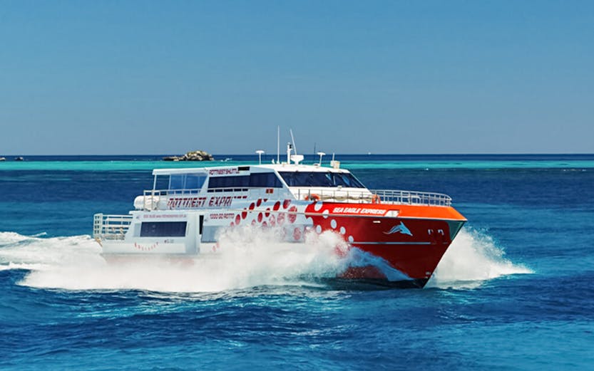 Ferry cruising on blue waters near Rottnest Island, Australia.