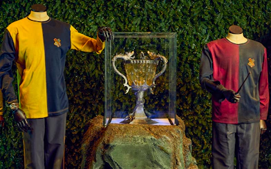 Triwizard Tournament Cup display with Hogwarts uniforms at Warner Bros. Studio Tour London.