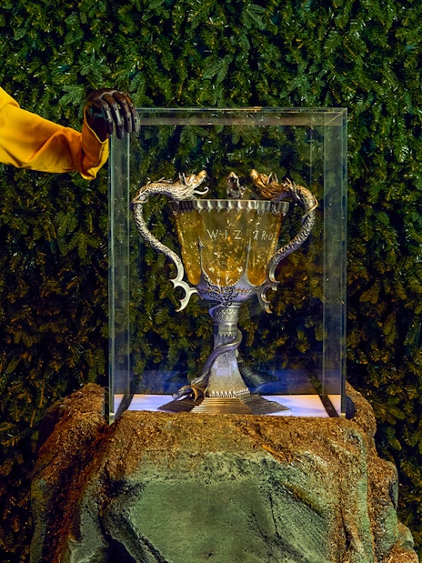 Triwizard Tournament Cup display with Hogwarts uniforms at Warner Bros. Studio Tour London.