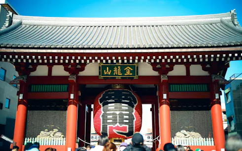 Senso-ji Temple entrance with large red lantern in Asakusa, Tokyo, part of walking tour.