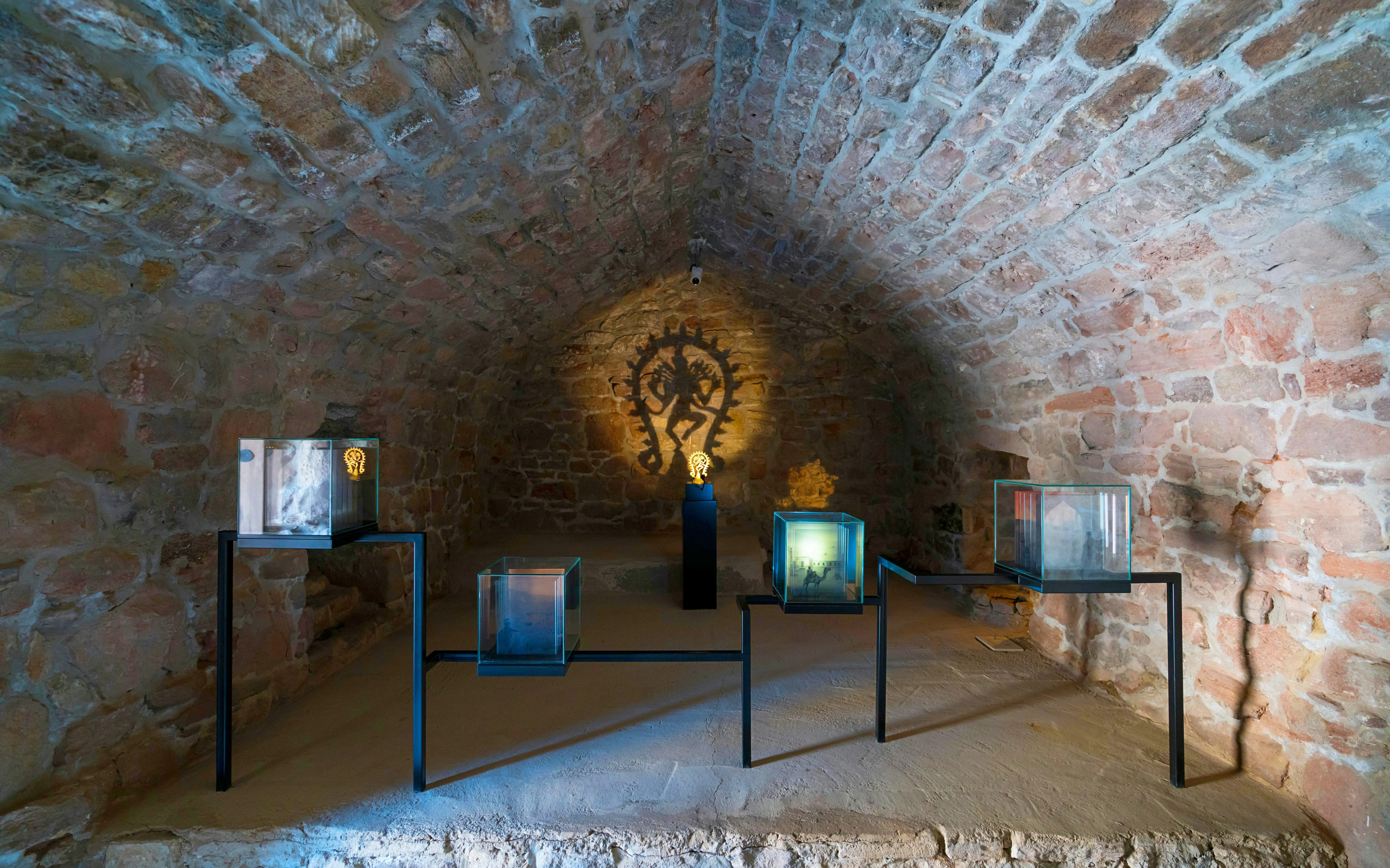 Exhibit inside Ateshgah Fire Temple, Surakhani, Baku, showcasing historical artifacts.
