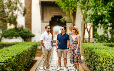 Visitors enjoying a guided tour at Bahia Palace gardens.