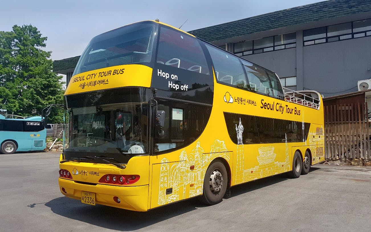 Yellow double-decker bus for Dongdaemun Hop-on Hop-off Tour in Seoul.