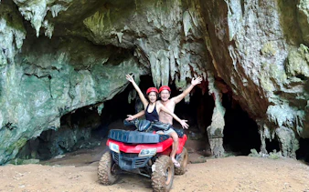 Kayaking and ATV adventure in Krabi cave setting.
