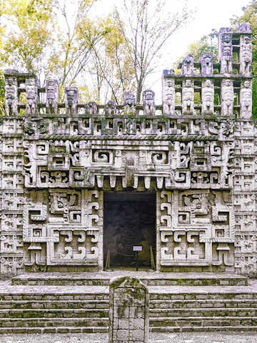 Reconstructed Maya temple facade at the Museum of Anthropology, showcasing intricate ancient designs.