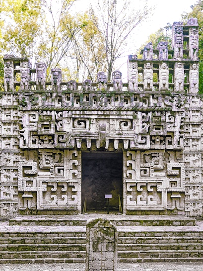 Reconstructed Maya temple facade at the Museum of Anthropology, showcasing intricate ancient designs.