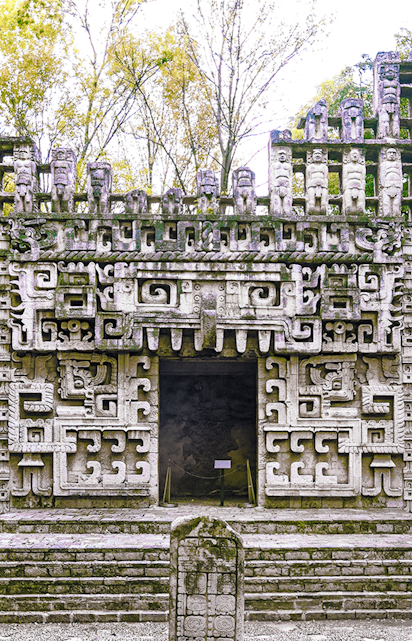 Reconstructed Maya temple facade at the Museum of Anthropology, showcasing intricate ancient designs.