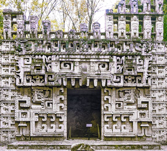 Reconstructed Maya temple facade at the Museum of Anthropology, showcasing intricate ancient designs.