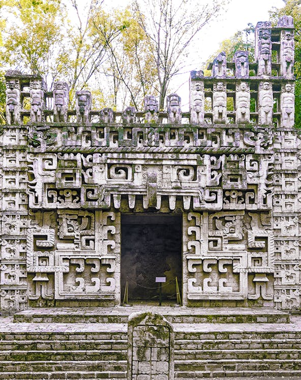 Reconstructed Maya temple facade at the Museum of Anthropology, showcasing intricate ancient designs.