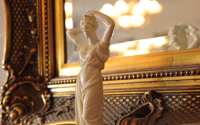 Elegant statue detail at Evening Chopin Piano Concert venue.