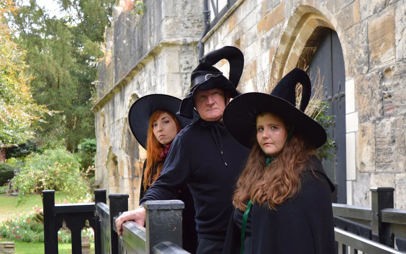 People in witch costumes on York Old Town walking tour.