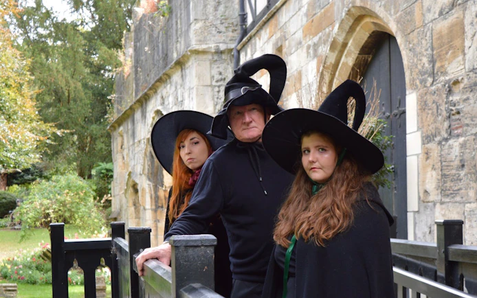 People in witch costumes on York Old Town walking tour.