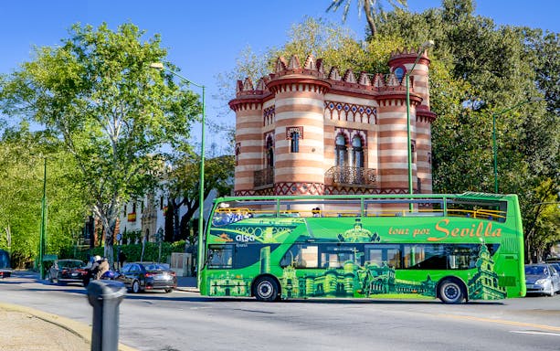 Sevilla hop-on hop-off bus passing Costurero de la Reina.