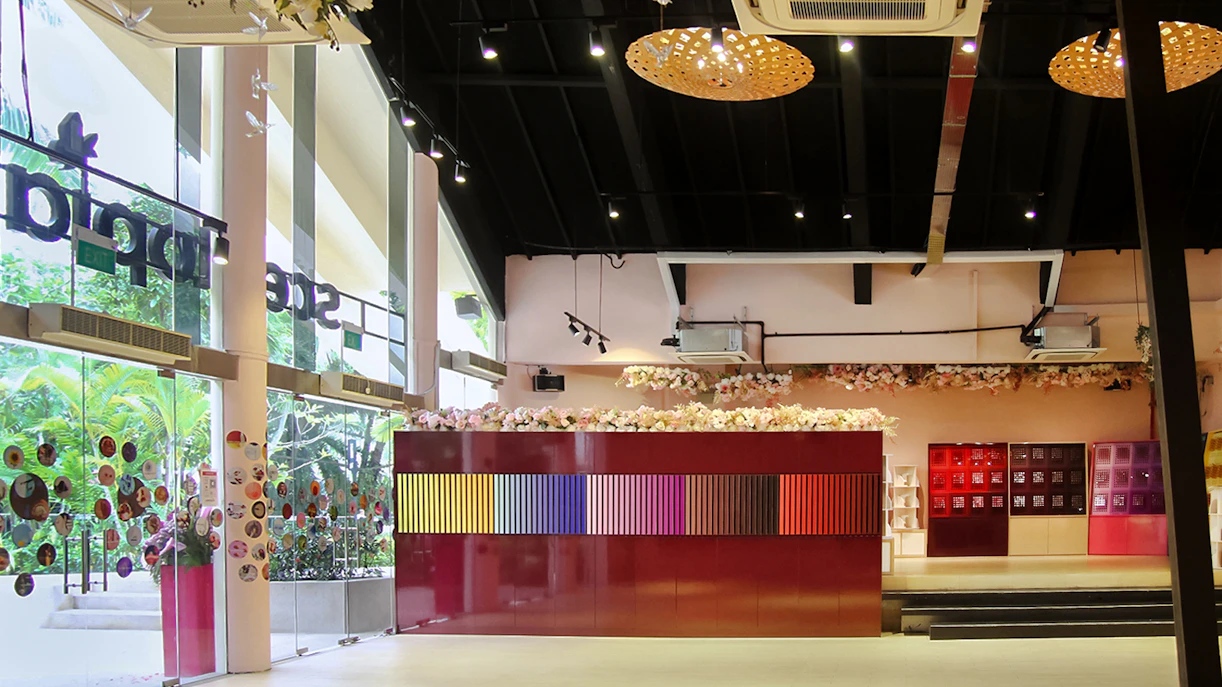 Scentopia Sentosa interior with colorful display and floral decor.