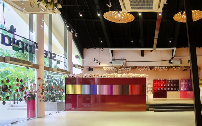 Scentopia Sentosa interior with colorful display and floral decor.