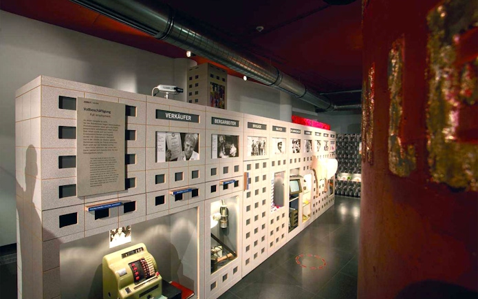 DDR Museum Berlin exhibit showcasing East German life and employment.