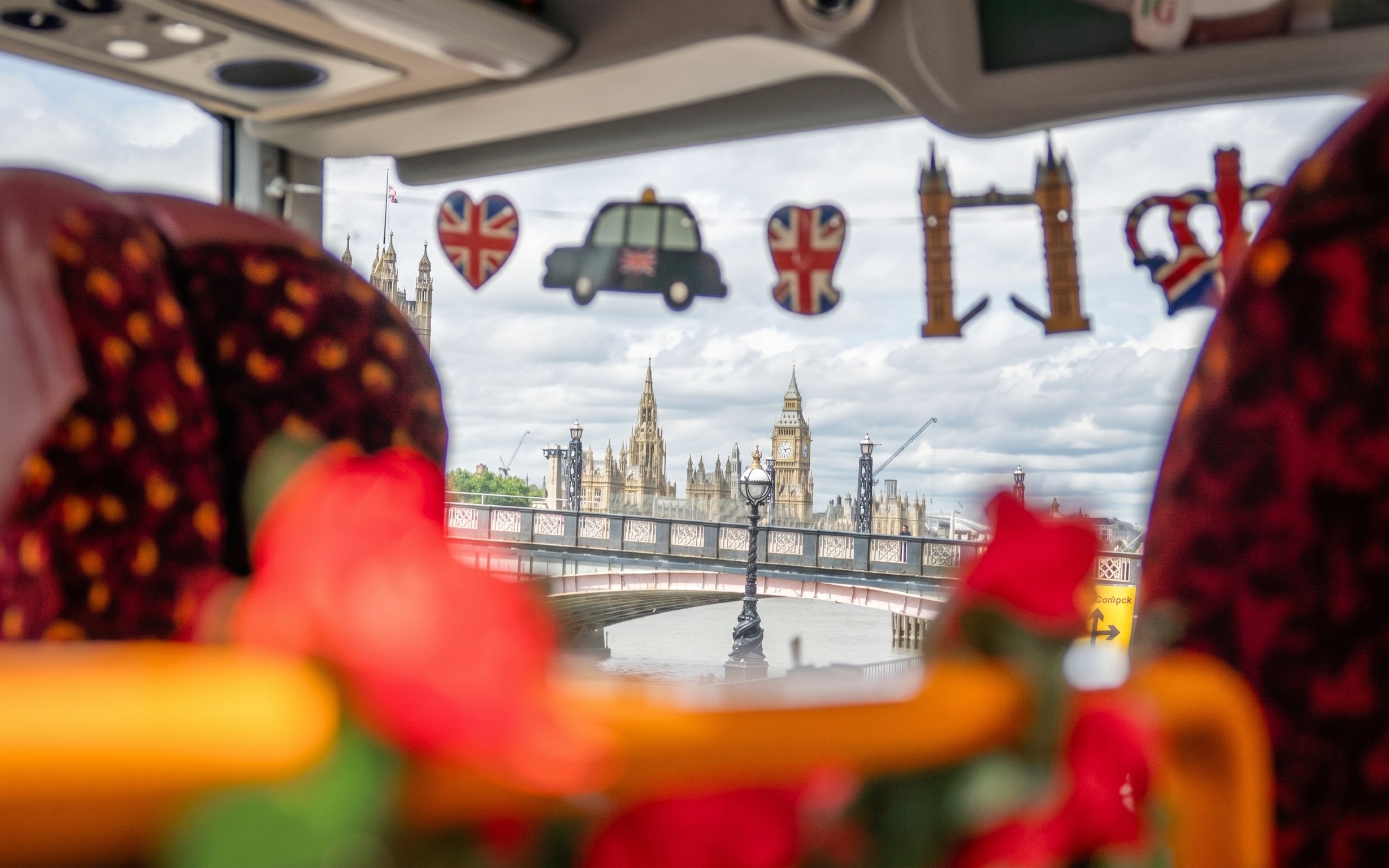 View of Big Ben and Westminster from inside a London sightseeing bus.