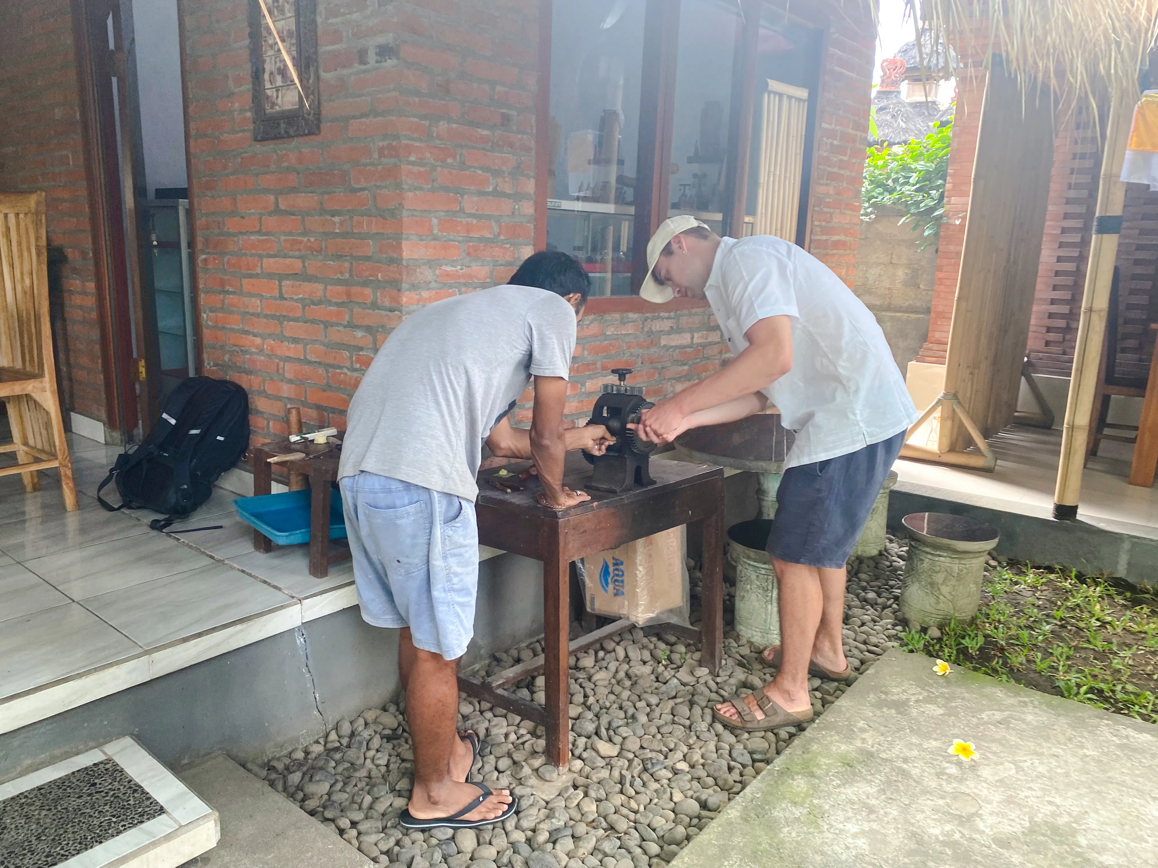 Silver jewelry making class participants using tools in Ubud, Bali.