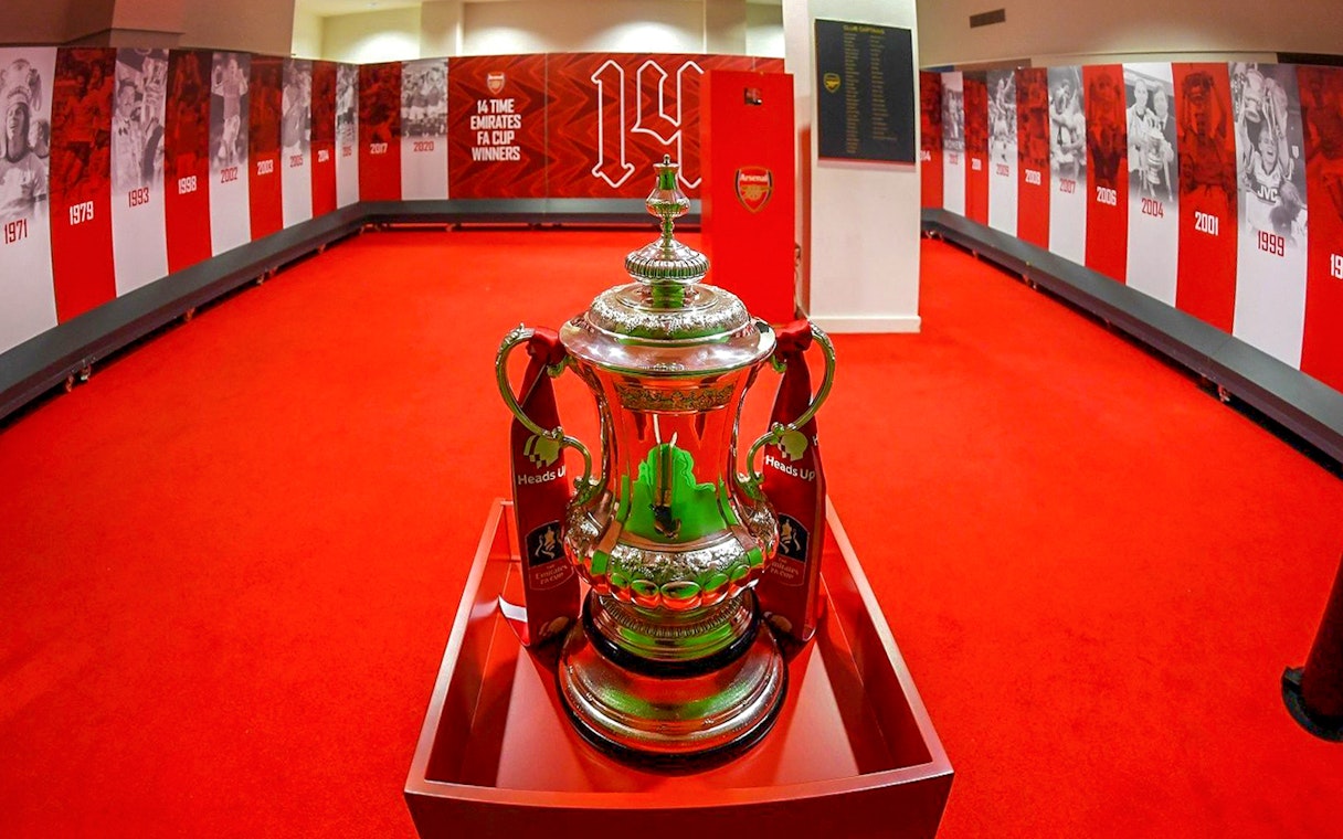 FA Cup replica displayed in Arsenal stadium locker room.