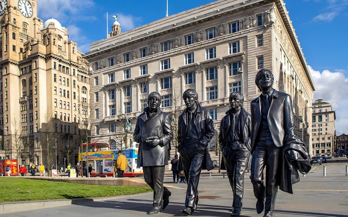 Statues of famous musicians in front of the Royal Liver Building, Liverpool.