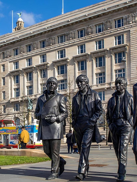 Statues of famous musicians in front of the Royal Liver Building, Liverpool.