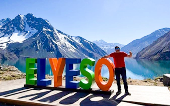 Cajón del Maipo with Embalse del Yeso and colorful sign, Santiago tour.