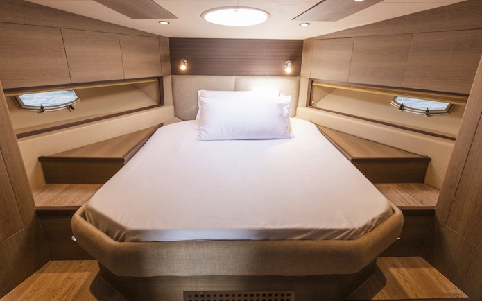 Luxurious cabin interior on a 46 ft private yacht rental in Dubai.