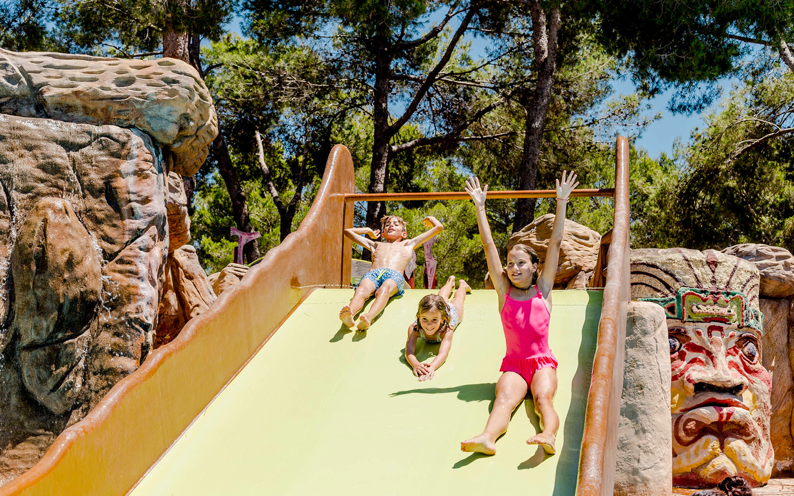 Children enjoying Polynesia water slide at Aqualand El Arenal.