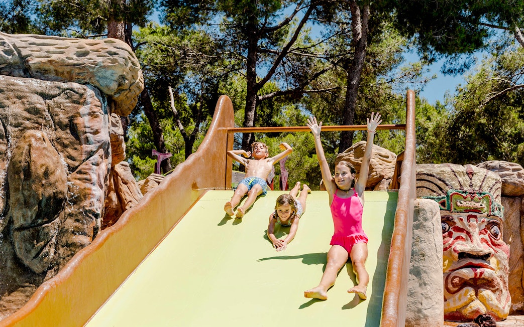 Children enjoying Polynesia water slide at Aqualand El Arenal.