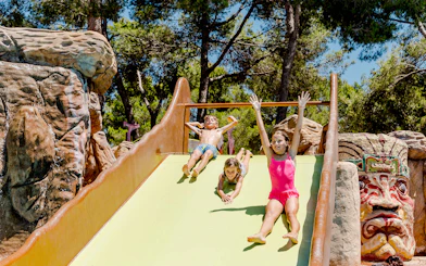 Children enjoying Polynesia water slide at Aqualand El Arenal.