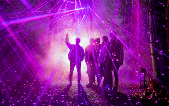 Group under purple stardust rays at Astra Lumina, Currumbin Wildlife Sanctuary.